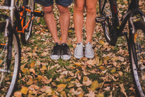 Image of a man a woman's legs with bicycles
